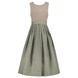 Two-tone dress with beige top and green skirt on a white background