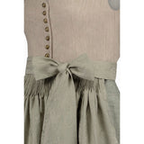 Traditional Bavarian dirndl with a beige bodice and green skirt on a white background