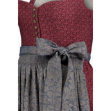 Two-patterned dress with a red floral top and blue paisley skirt on a white background