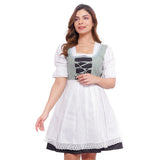 Woman wearing a traditional German dirndl dress on a white background